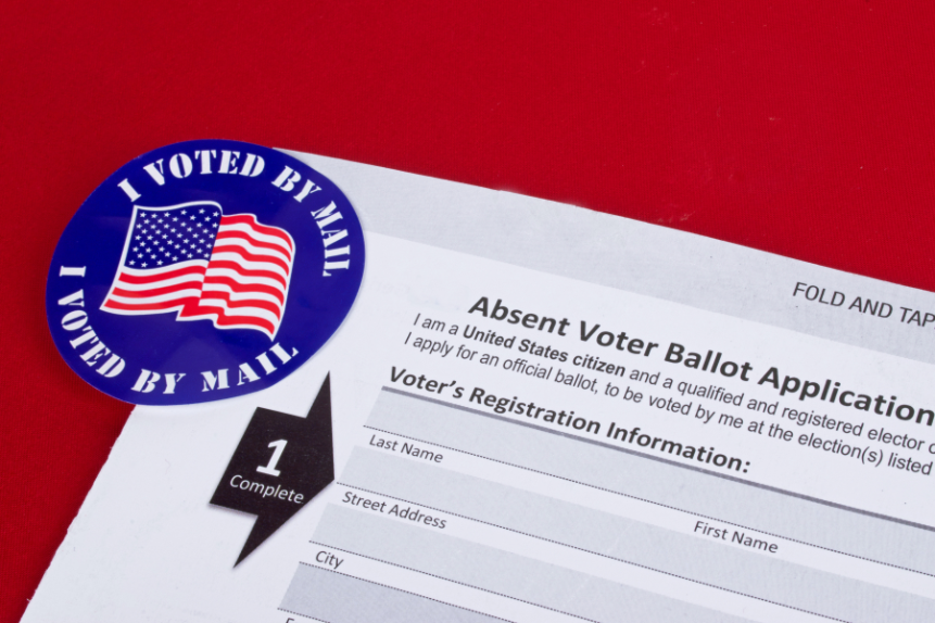 An absent voter ballot application, with an I voted by mail sticker.